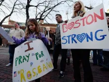 Mother and daughter at an April 21, 2013 candlelight vigil for those injured and killed at the Boston Marathon bombings